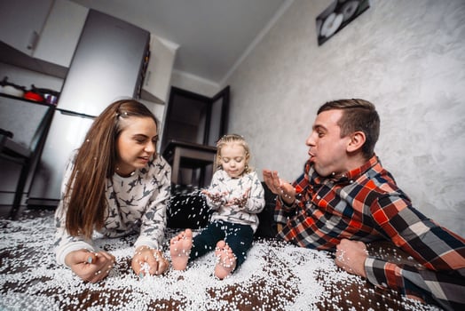 Happy family playing together on the floor photo