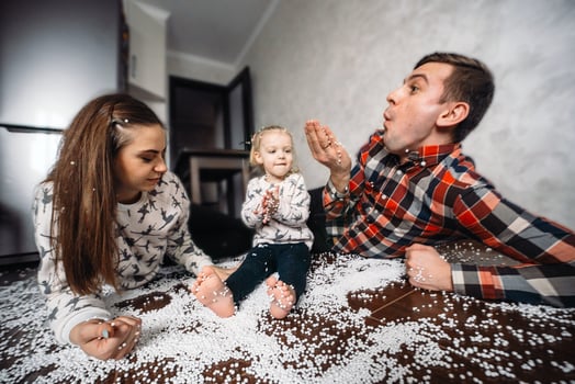 Happy family playing together on the floor photo