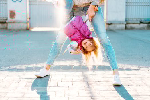Mom and girl playing, having fun photo