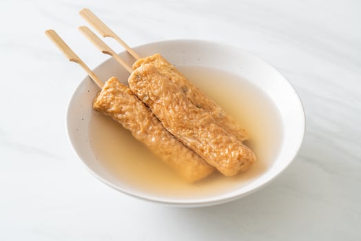Odeng - Korean fish cake skewer in soup photo
