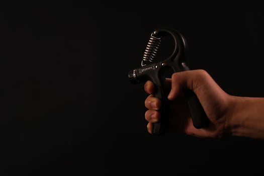 closeup of hand holding the hand grip workout photo