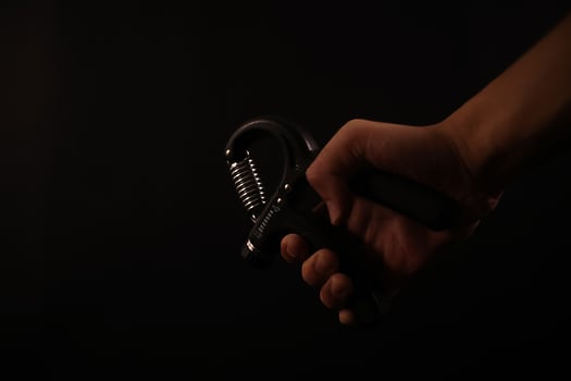 closeup of hand holding the hand grip workout photo