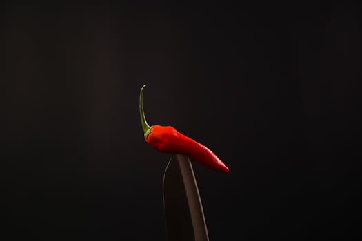 premium chili in the bled with black background landscape photo