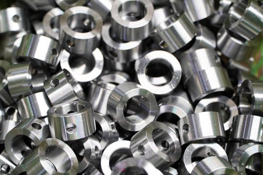Shiny steel parts background. Regular industrial metal production pattern with selective focus.High precision steel automotive parts manufacturing by innovative CNC machining photo