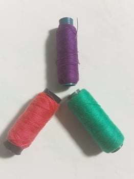 sewing thread forms a peace symbol photo