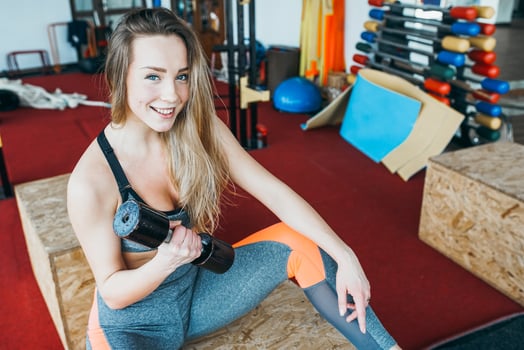 Athletic woman doing exercises in the gym photo