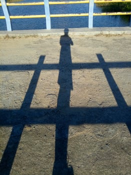 shadow of man on bridge background photo
