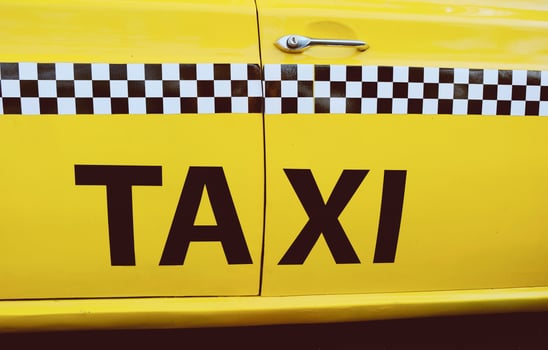 The side of New York City yellow taxi cab photo