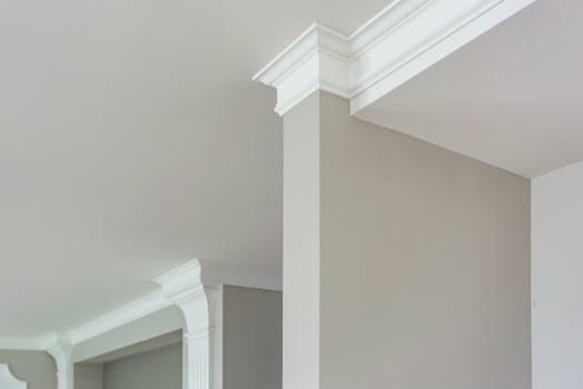 Detail of corner ceiling with intricate crown molding. photo