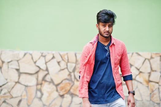 Portrait of young stylish indian man model pose in street. photo