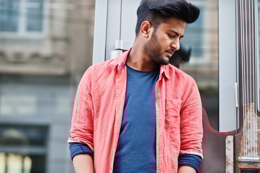 Portrait of young stylish indian man model pose in street. photo