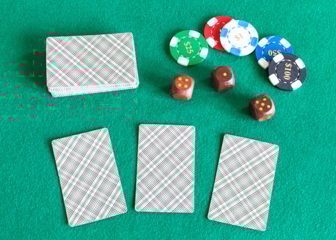 card decks, casino tokens and dices on table photo