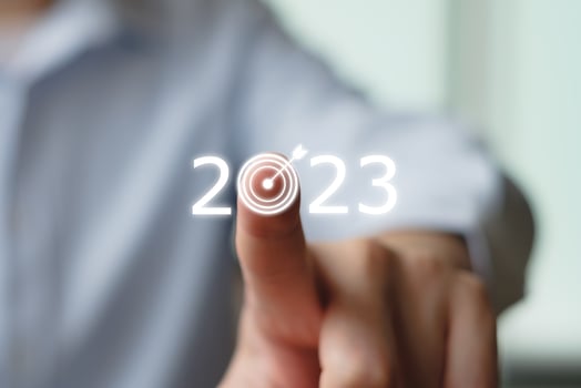 2023 goal and target. Hand touch dartboards with 2023 number for set strategy and plan for future. Business management and financial concept. photo