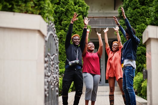 Four african friends having fun outdoors. Two black girls with guys. photo