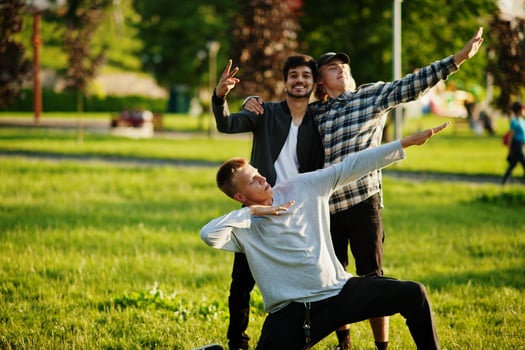 Three multi ethnic guys posed outdoor. photo