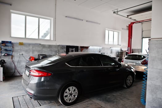 Car repair and maintenance theme. Cars in auto service. photo