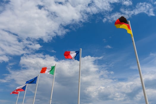 Various flags waving in the wind photo