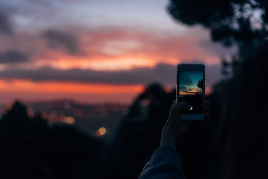Young woman taking photo