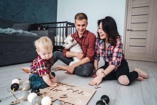Happy family are playing together on the floor photo
