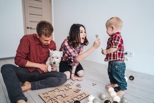 Happy family are playing together on the floor photo