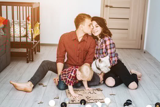 Happy family are playing together on the floor photo