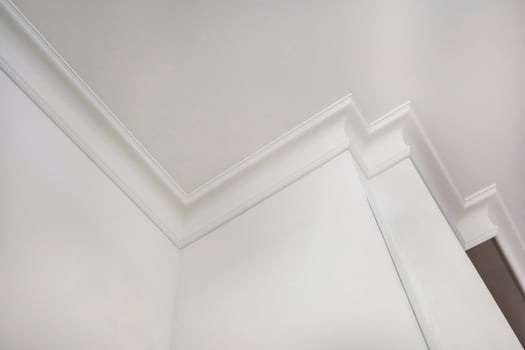 corner of ceiling and walls with intricate crown moulding. Interior construction and renovation concept. photo