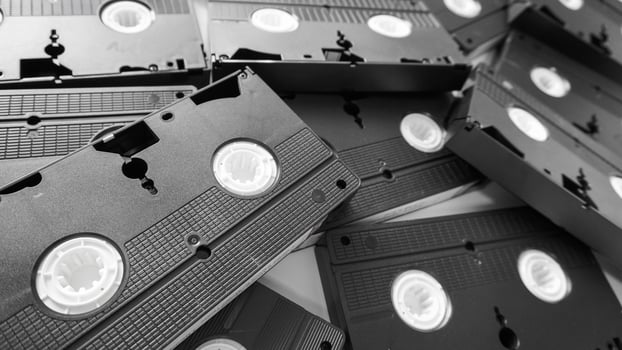 Messy stack of VHS tapes. Video Home System tape cassettes. photo