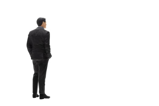 Miniature people businessman wearing black suit with clipping path photo