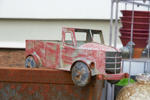 Vintage rusty toy truck for garden decoration. photo