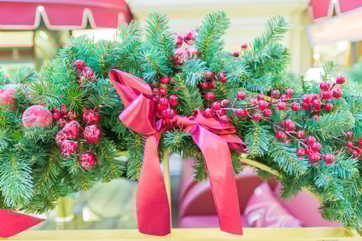 Christmas and New Year holidays background. Christmas tree decorated with sred baw and berries. Glittering and sparkling. Celebration concept photo