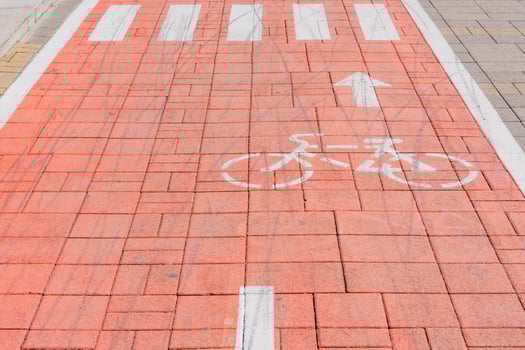 A bike lane for cyclist. Bicycle sign or icon on the road in the park photo