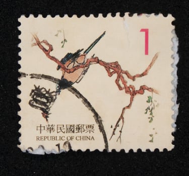 Sidoarjo, Jawa timur, Indonesia, 2022 - Stamp collection philately with the theme of an illustration of a bird perching on a tree photo