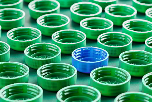 green and blue plastic bottle caps photo