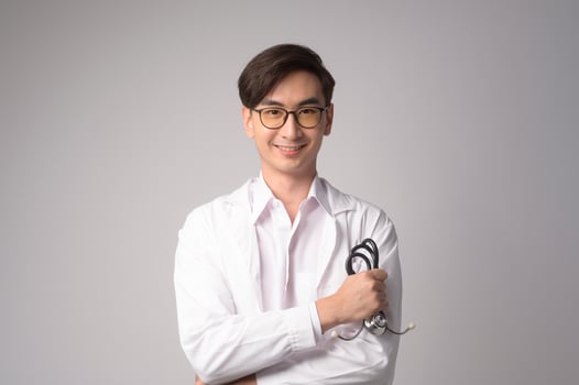 Portrait of male confident doctor over white background studio, healthcare and Medical technology concept. photo