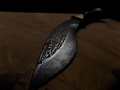 a knife with an iron engraving photo