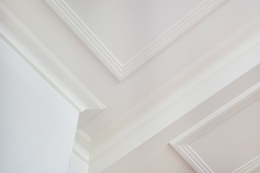 Detail of corner ceiling cornice with intricate crown molding. photo