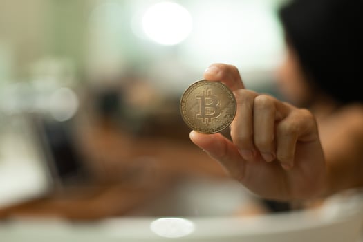 Young 20s Asian Sexy woman trade cryptocurrency btc bitcoin on internet digital tablet in lingeries photo