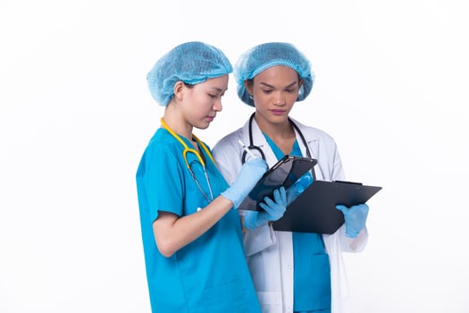 Full length Professional physician Doctor stand in hospital uniform discuss patient chart condition on Tablet. Woman Practitioner wear coat confident in clinic, isolated white background photo