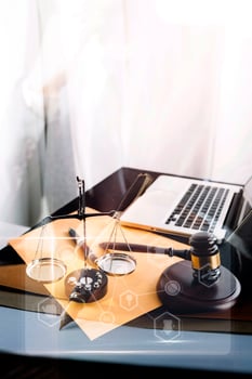Business and lawyers discussing contract papers with brass scale on desk in office. Law, legal services, advice, justice and law concept picture with film grain effect photo