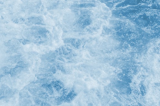 sea foam in the ocean. Dark water, storm waves. top view photo