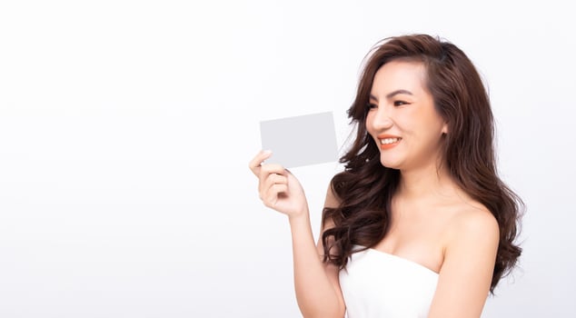 Asian woman show beautiful smile happy lips, hold empty blank package capsule box for treatment photo