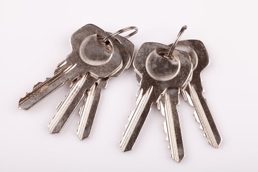 Set of old house keys  on white background photo