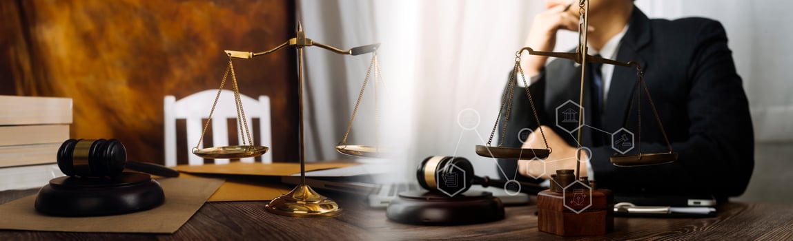 justice and law concept.Male judge in a courtroom on wooden table and Counselor or Male lawyer working in office. Legal law, advice and justice concept. photo