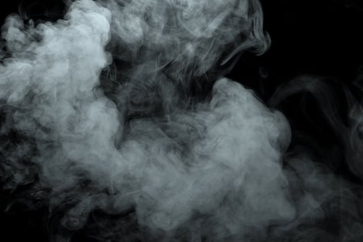 Abstract powder or smoke isolated on black background photo