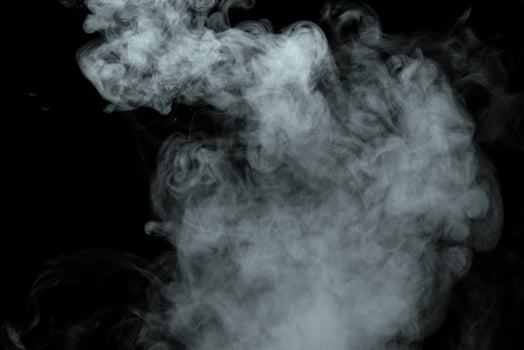 Abstract powder or smoke isolated on black background photo