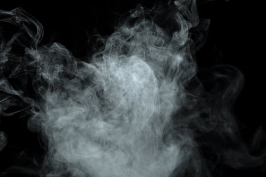 Abstract powder or smoke isolated on black background photo