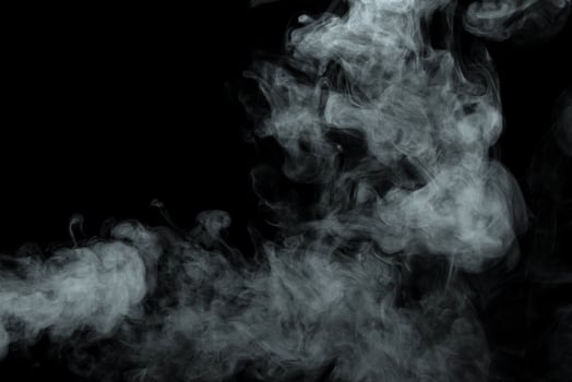 Abstract powder or smoke isolated on black background photo