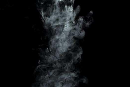 Abstract powder or smoke isolated on black background photo