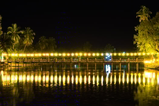 Night view of bridge decorated with lanterns photo
