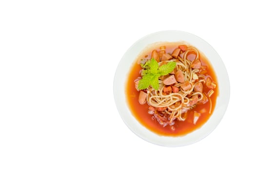 Spaghetti pasta with sausage on black background,clipping path. photo
